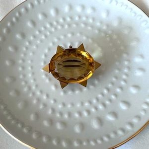 Citrine Brooch/Pendant. Large gem with a 9 carat gold starburst frame. Antique